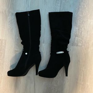 Black high heel boots. Never been worn.